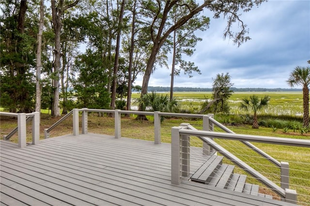 wooden terrace featuring a rural view