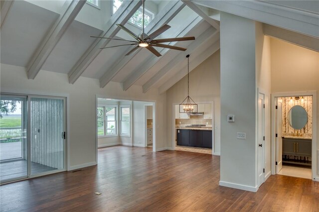 2593 Julienton Dr NE, Townsend, GA 31331 - unfurnished living room featuring high vaulted ceiling, a chandelier, dark wood-style flooring, baseboards, and beamed ceiling