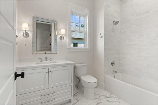 full bathroom featuring tiled shower / bath, vanity, and toilet