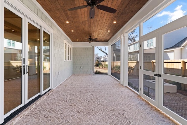 unfurnished sunroom with wooden ceiling