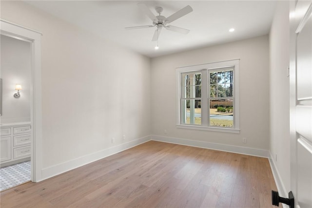 empty room with light hardwood / wood-style floors and ceiling fan