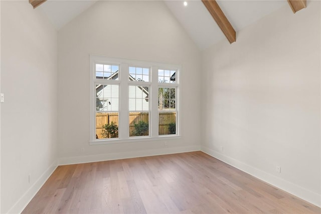 interior space featuring high vaulted ceiling, beamed ceiling, and light wood-type flooring