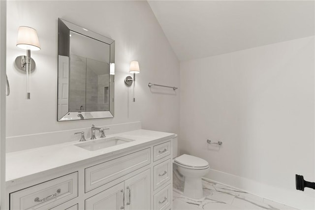 bathroom with vanity, vaulted ceiling, an enclosed shower, and toilet