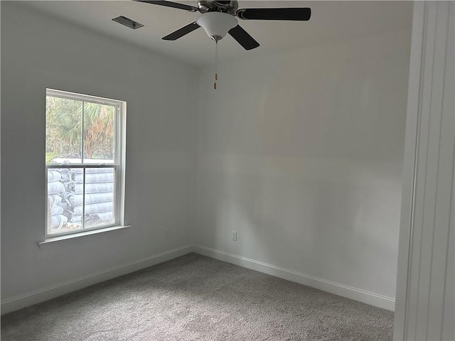 empty room with carpet flooring and ceiling fan