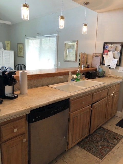 1246 Fiddler Trce NE, Townsend, GA 31331 - kitchen with dishwasher, a sink, light countertops, and decorative light fixtures