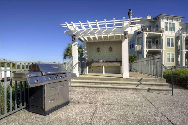 view of patio with a grill and a pergola