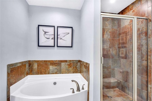 bathroom with shower with separate bathtub