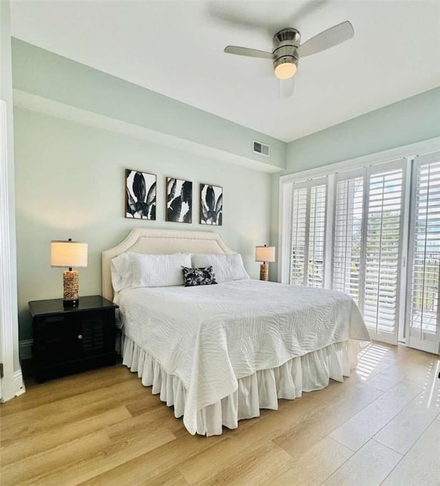 bedroom with ceiling fan, access to outside, and light hardwood / wood-style flooring