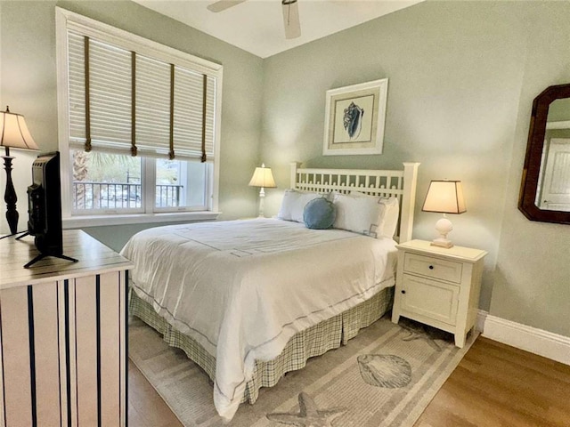 bedroom featuring ceiling fan and light hardwood / wood-style floors