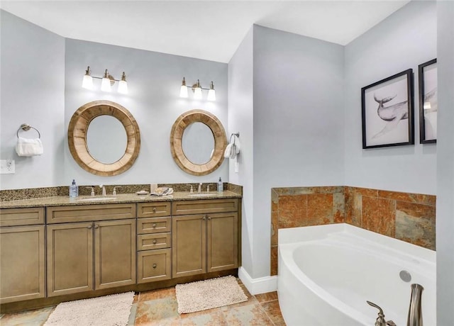 bathroom featuring vanity and a bath