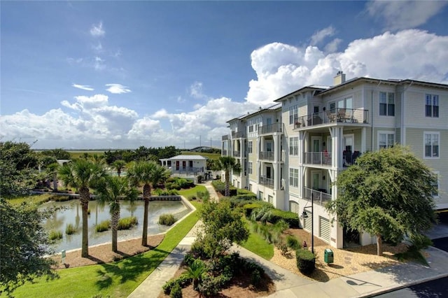 surrounding community with a water view