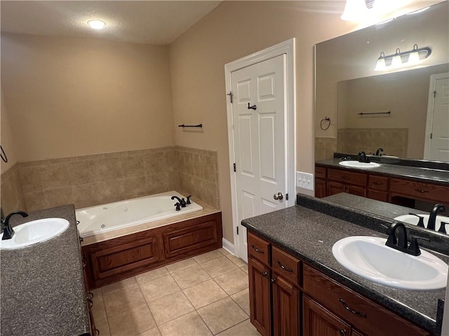 134 Hillery Trce, Brunswick, GA 31523 - bathroom with a tub with jets, two vanities, and tile patterned floors
