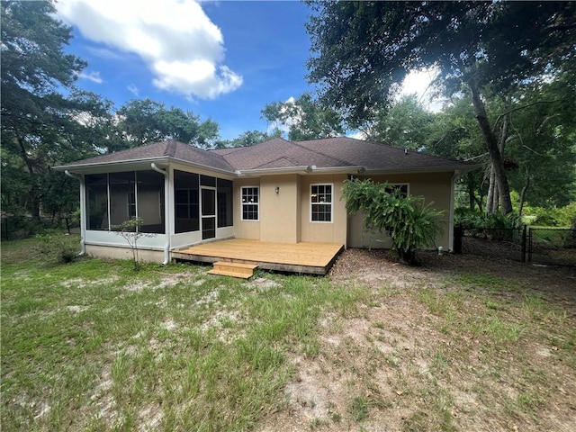 134 Hillery Trce, Brunswick, GA 31523 - back of property with a sunroom and a wooden deck