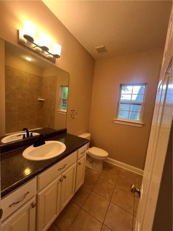 134 Hillery Trce, Brunswick, GA 31523 - bathroom featuring tile patterned floors, vanity, and a tile shower