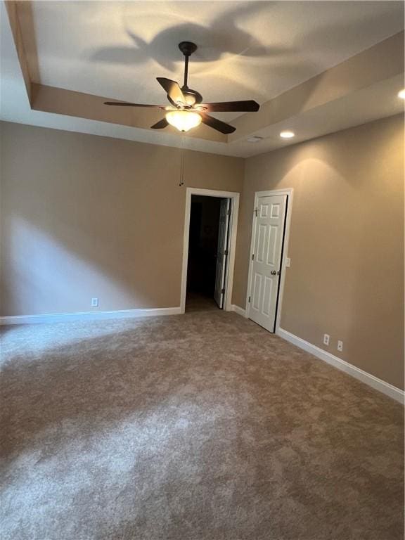 134 Hillery Trce, Brunswick, GA 31523 - empty room with a raised ceiling, carpet, a ceiling fan, and recessed lighting