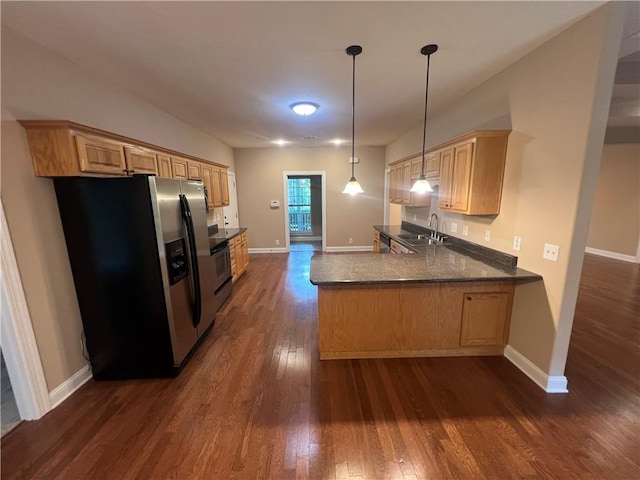 134 Hillery Trce, Brunswick, GA 31523 - kitchen with stainless steel appliances, dark wood-style flooring, a peninsula, pendant lighting, and dark countertops