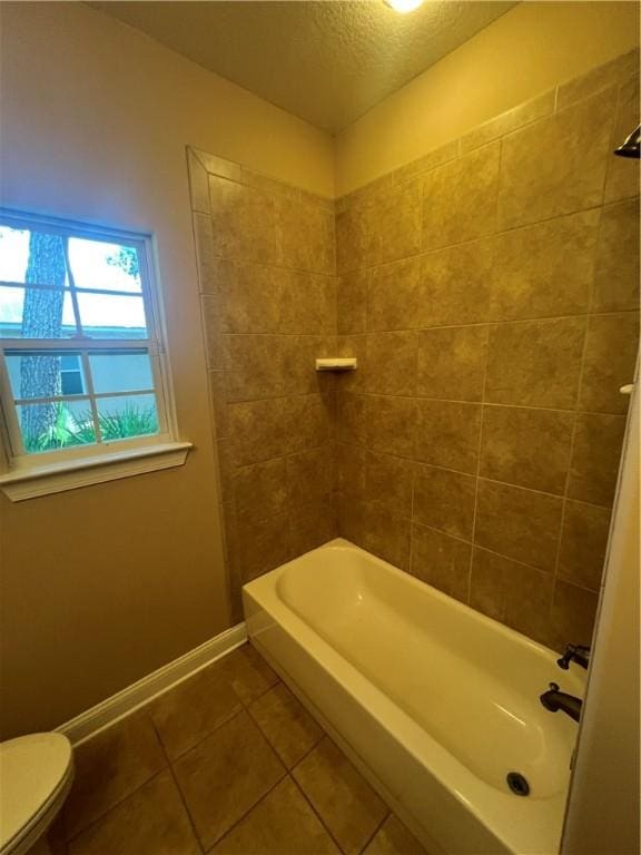 134 Hillery Trce, Brunswick, GA 31523 - full bath with tile patterned flooring, a textured ceiling, and tub / shower combination