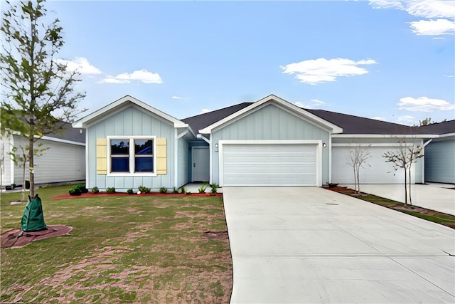 222 Bottlebrush Walk, Brunswick, GA 31525 - ranch-style house featuring board and batten siding, an attached garage, driveway, and a front yard