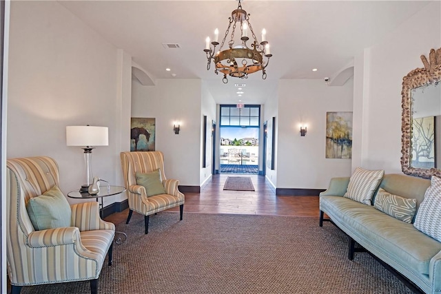 222 Bottlebrush Walk, Brunswick, GA 31525 - foyer with a chandelier, arched walkways, recessed lighting, wood finished floors, and carpet floors