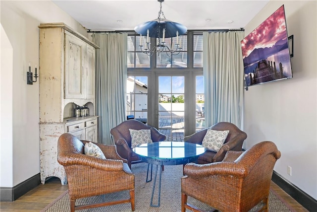 222 Bottlebrush Walk, Brunswick, GA 31525 - dining room featuring a chandelier and wood finished floors
