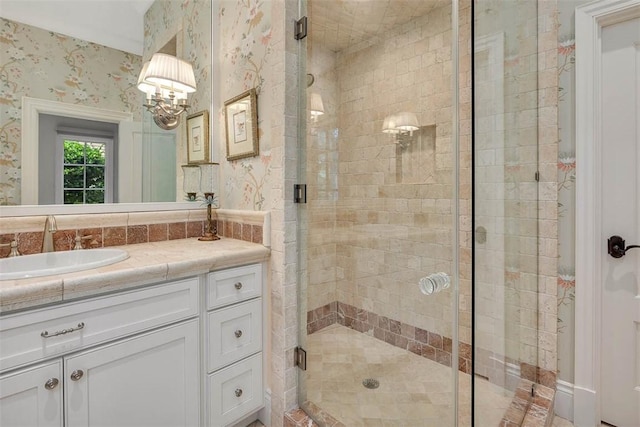 117 Hawkins Island Cir, Saint Simons Island, GA 31522 - bathroom featuring wallpapered walls, vanity, and a stall shower