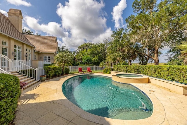 117 Hawkins Island Cir, Saint Simons Island, GA 31522 - view of pool featuring a patio and a pool with connected hot tub