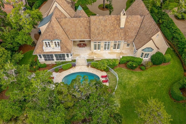 117 Hawkins Island Cir, Saint Simons Island, GA 31522 - rear view of house with french doors, an outdoor pool, a patio, and a chimney