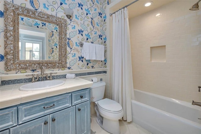 117 Hawkins Island Cir, Saint Simons Island, GA 31522 - bathroom with wallpapered walls, tile patterned floors, toilet, vanity, and shower / bath combo with shower curtain