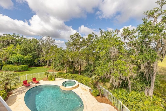 117 Hawkins Island Cir, Saint Simons Island, GA 31522 - view of pool featuring a fenced backyard, an in-ground hot tub, a patio area, and view of scattered trees