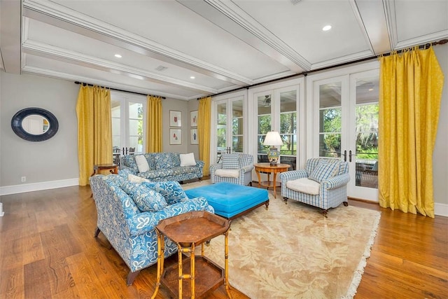117 Hawkins Island Cir, Saint Simons Island, GA 31522 - living area with french doors, baseboards, wood finished floors, beamed ceiling, and crown molding