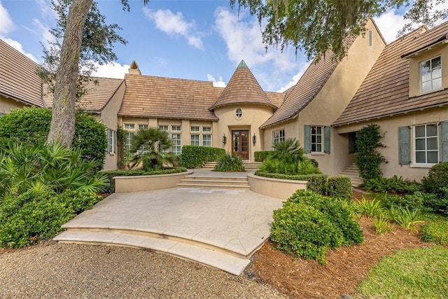 117 Hawkins Island Cir, Saint Simons Island, GA 31522 - exterior space with stucco siding and a tiled roof