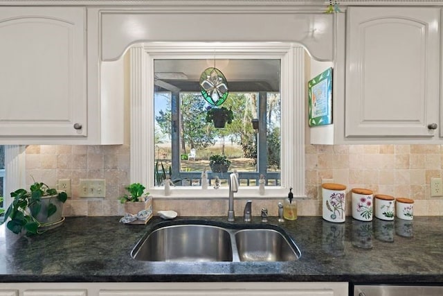 kitchen with sink, decorative backsplash, and white cabinets