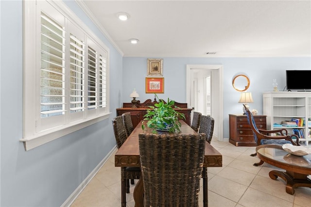 dining space featuring tile patterned flooring, visible vents, crown molding, and baseboards