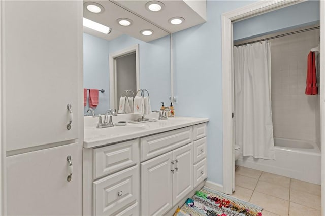 full bath featuring shower / bath combo with shower curtain, toilet, a sink, tile patterned flooring, and double vanity