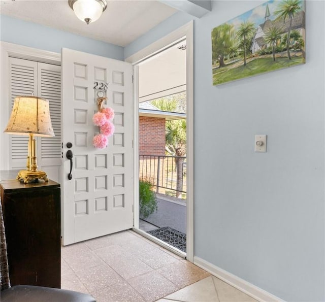 entrance foyer featuring baseboards