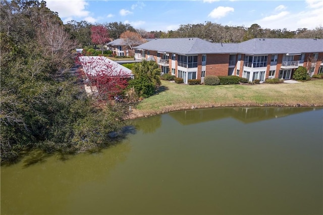 birds eye view of property featuring a water view