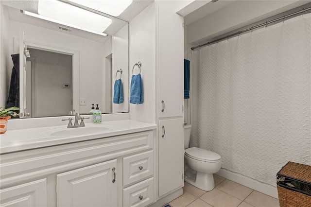 bathroom with visible vents, toilet, a shower with curtain, tile patterned floors, and vanity