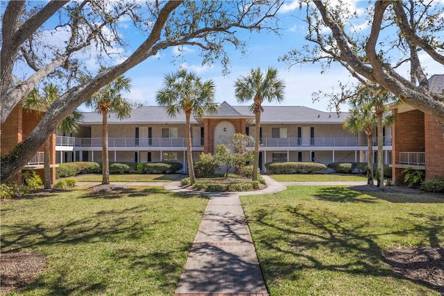 view of property with a front lawn