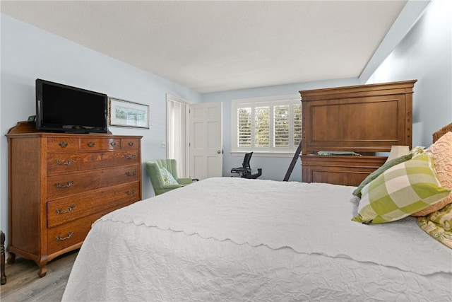 bedroom featuring light wood-style flooring