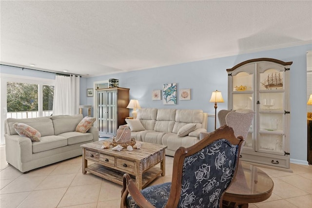 living room with a textured ceiling, light tile patterned flooring, and ornamental molding