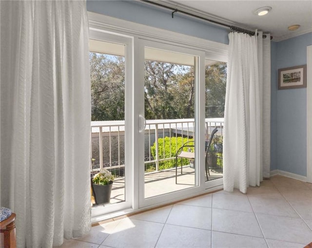 doorway to outside with tile patterned flooring