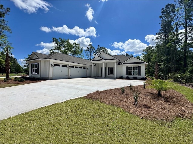 154 Ossabaw Way, Waverly, GA 31565 - view of front of house with a garage and driveway