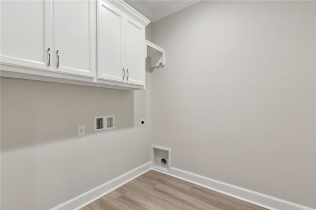 154 Ossabaw Way, Waverly, GA 31565 - laundry area featuring hookup for an electric dryer, cabinet space, light wood finished floors, and hookup for a washing machine