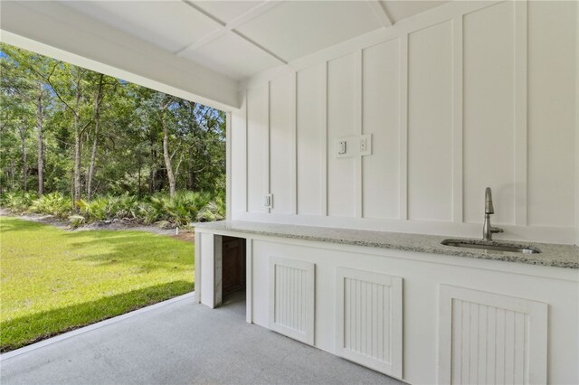 154 Ossabaw Way, Waverly, GA 31565 - garage with a sink and view of wooded area