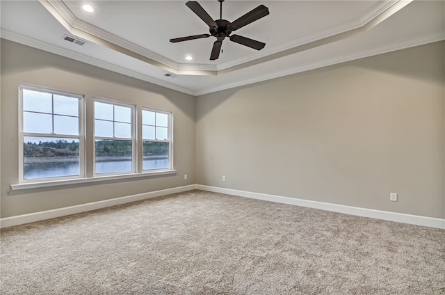 154 Ossabaw Way, Waverly, GA 31565 - carpeted empty room with a raised ceiling, ornamental molding, healthy amount of natural light, ceiling fan, and baseboards