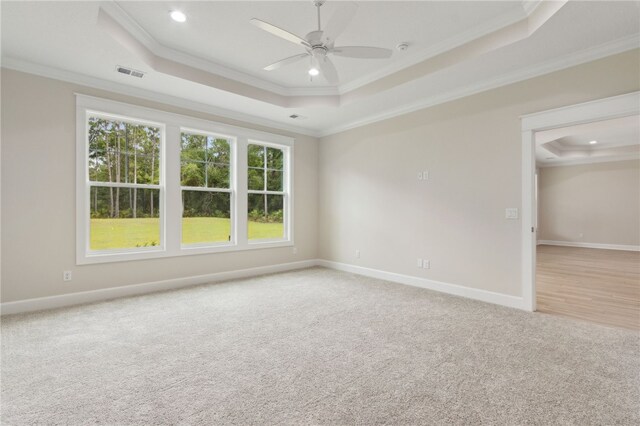 154 Ossabaw Way, Waverly, GA 31565 - unfurnished room with a raised ceiling, crown molding, light colored carpet, ceiling fan, and recessed lighting