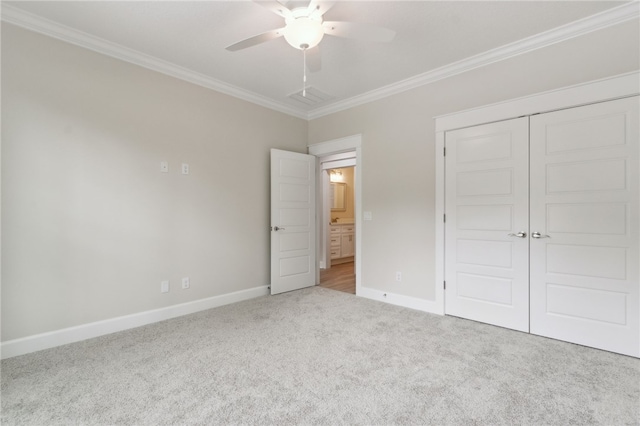 154 Ossabaw Way, Waverly, GA 31565 - unfurnished bedroom with carpet floors, ornamental molding, a closet, and a ceiling fan