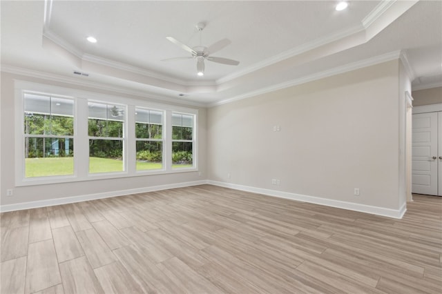 154 Ossabaw Way, Waverly, GA 31565 - spare room featuring a raised ceiling, ceiling fan, crown molding, light wood finished floors, and recessed lighting