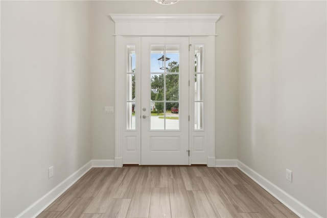 154 Ossabaw Way, Waverly, GA 31565 - entryway with baseboards and light wood-style floors