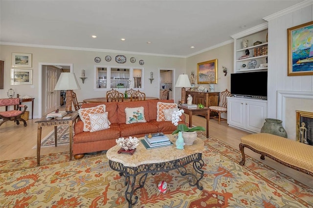 1212 River Club Dr, Sea Island, GA 31561 - living area with light wood-type flooring, crown molding, built in features, recessed lighting, and a fireplace